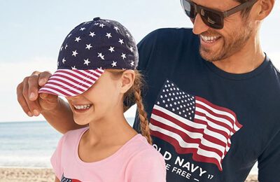 man and young girl with patriotic clothes