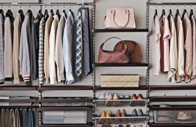 well organized closet with accessories and clothes