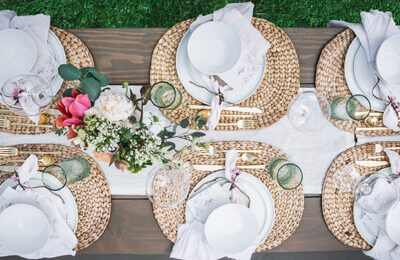 outdoor table with fancy plate settings