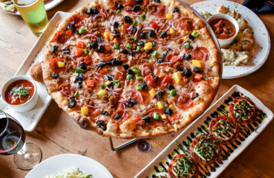 pizza on a table with other food