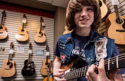 boy playing guitar