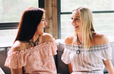 two girls smiling and laughing