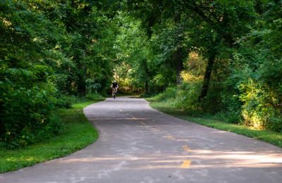 guy riding bike on greenway