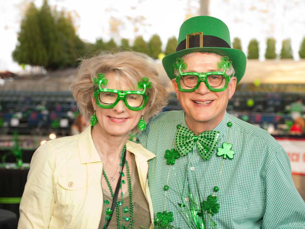 couple with green shamrock glasses