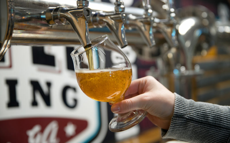 pouring a light beer from tap at Jekyll Brewing