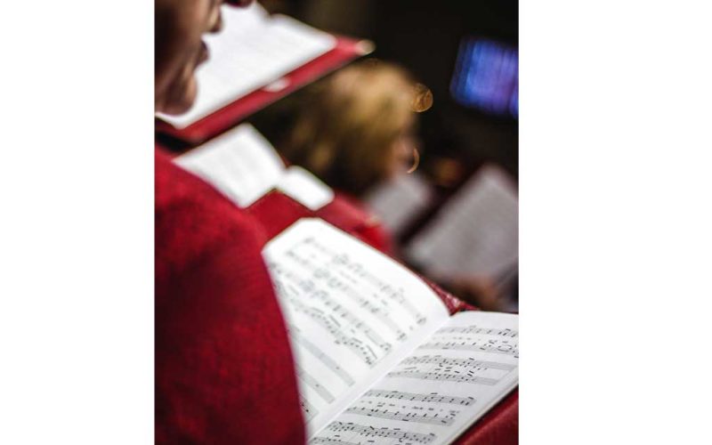 a chorus reading music