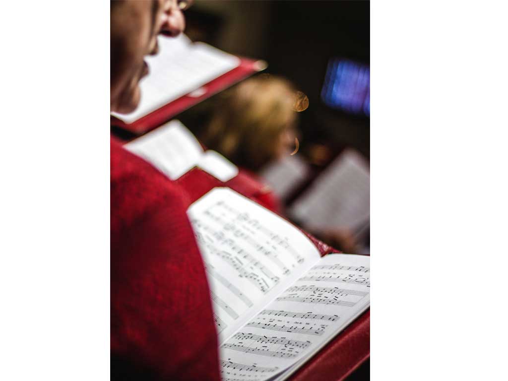 a chorus reading music