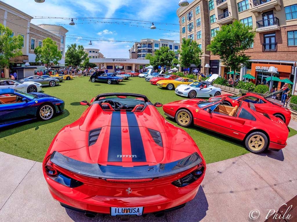 ferrari's and other fancy cars outside at Avalon