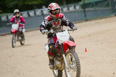 two people racing motorbikes