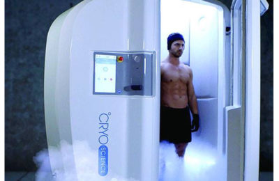 A man standing in an Icebox Cryotherapy booth