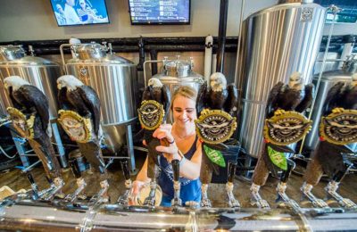 serving beer from a tap at Currahee Brewing Company