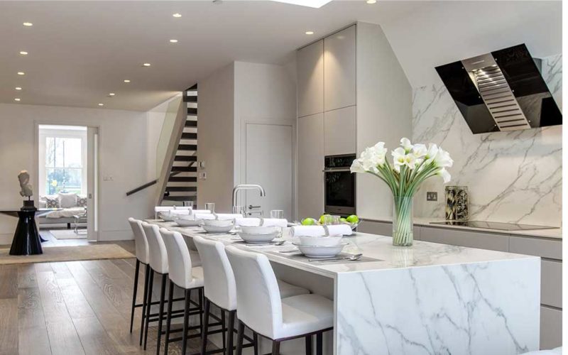 a gorgeous kitchen with marble countertops