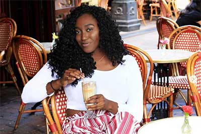 woman on patio with drink