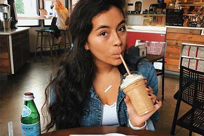 girl drinking iced coffee