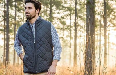 guy in vest in the woods