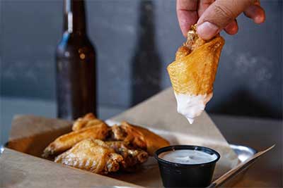 wing dipped in ranch