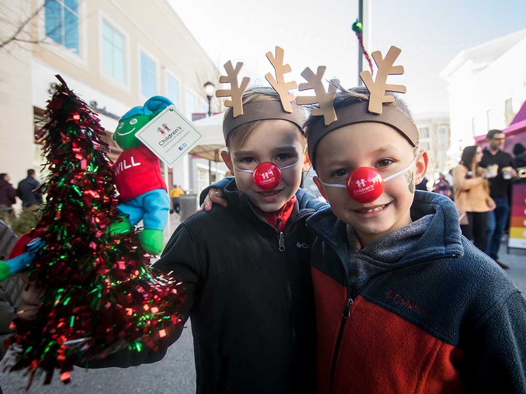 boys with red reindeer noses