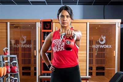 girl holding kettlebell