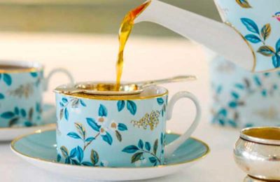 tea being poured into a cup