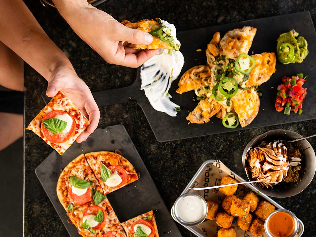 people hands dipping into food