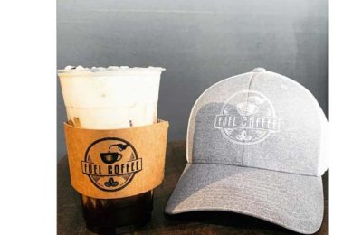 iced coffee next to hat