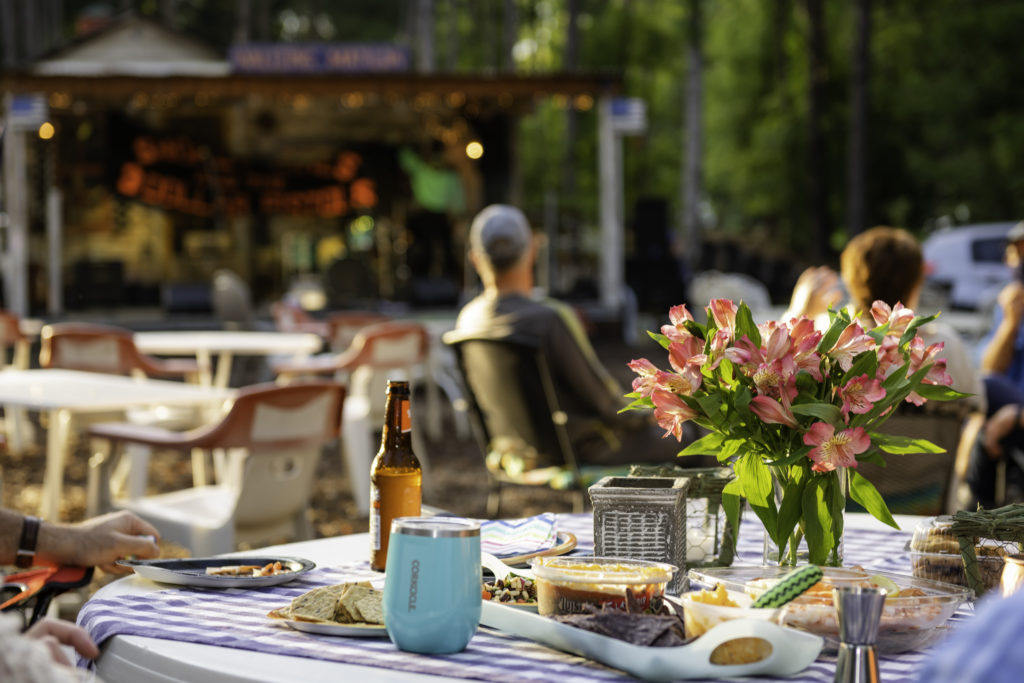 table with a beer bottle, drinks and food
