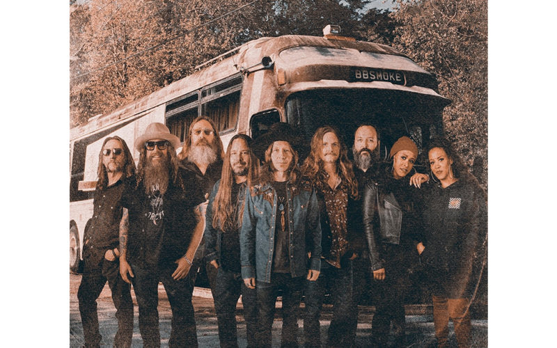 band in front of tour bus