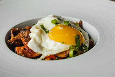 breakfast hash with sunny side up egg