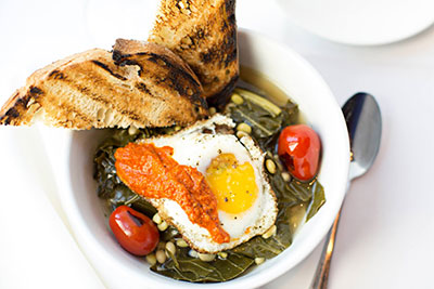 Breakfast with tomatoes, sunny side egg and grilled bread