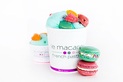 ice cream in a cup with macarons