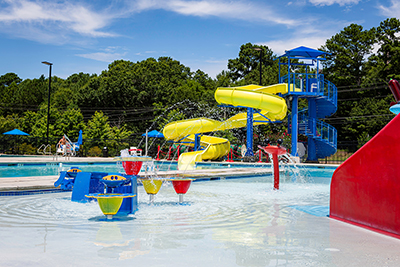 pool with large slide and water toys