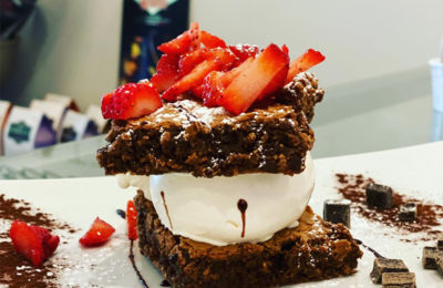 brownie ice cream sandwich with strawberries on top