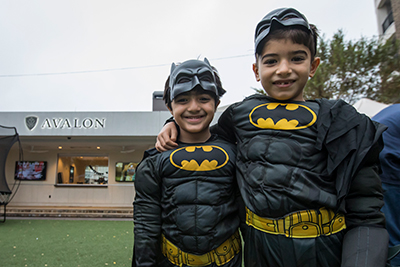 two boys in batman costumes