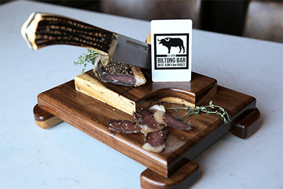 cutting board with meat and knife