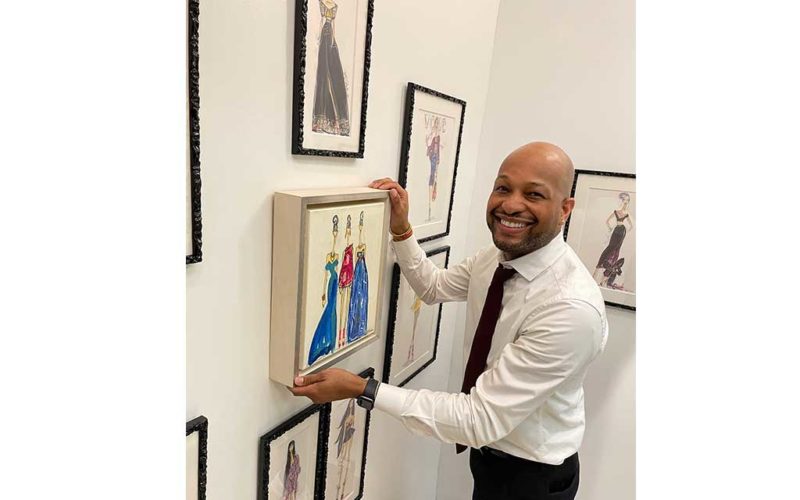 guy holding framed picture
