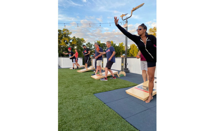 people playing cornhole