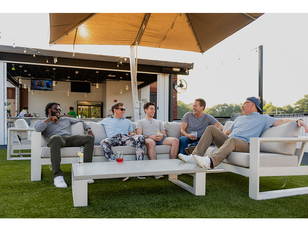 guys sitting on couch outside
