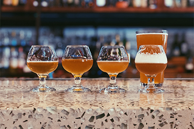 beer glasses lined up on counter