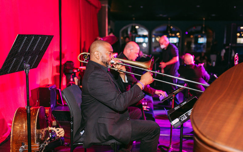 guy playing trumpet on stage