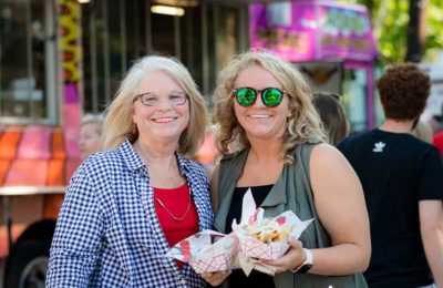 woman smiling holding food