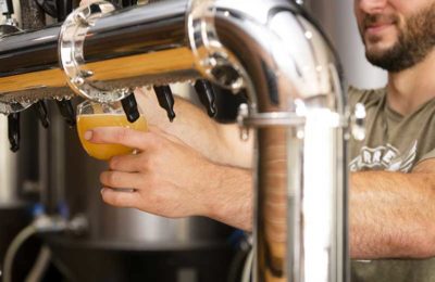 guy pouring beer