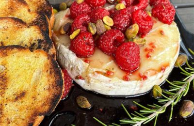 brie cheese with raspberries and bread