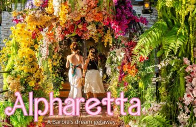 girls walking under flowers