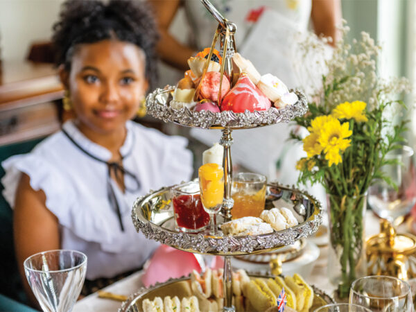 Girl enjoying pastries at a tea house