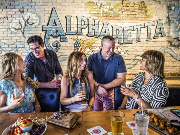 group of people at bar talking