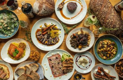 food laid out on a table at butcher and bottle