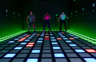 three people playing games at activate atlanta