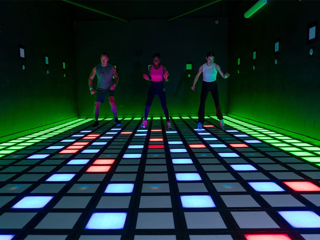 three people playing games at activate atlanta