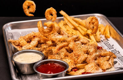 fried shrimp and fries basket.