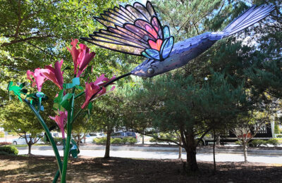 Humming bird sculpture on display in the park.